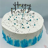 Tarta azul y plata artesanal vista frontal con topper Happy Birthday en Barcelona